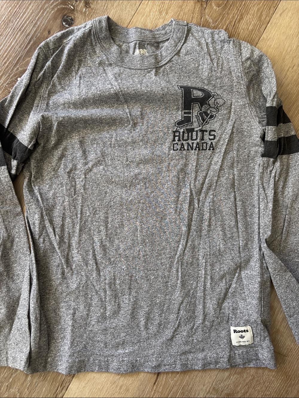 Roots boy’s Heather Grey Long-Sleeve Crew with hockey graphics